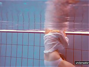 adorable sandy-haired plays nude underwater