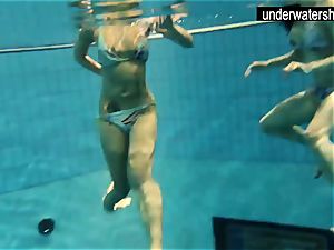 two marvelous amateurs displaying their bodies off under water